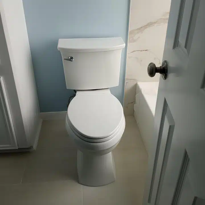Toilet installation in residential bathroom in Sugar Land, TX.