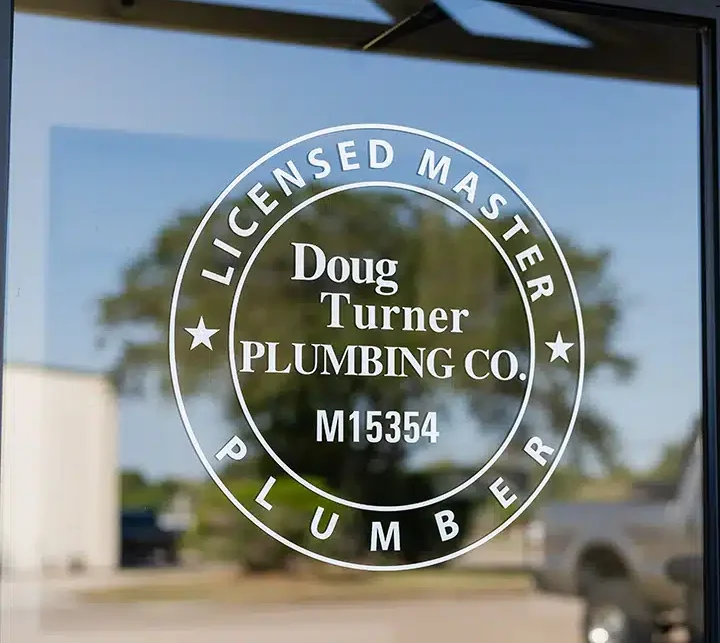 Doug Turner Plumbing logo on door in Sugar Land, TX.