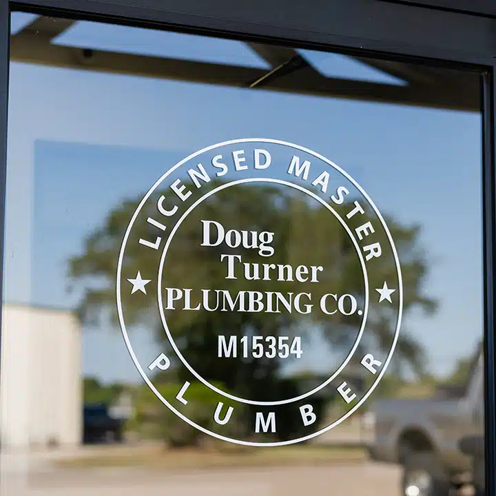 Doug Turner Plumbing logo on door in Sugar Land, TX.